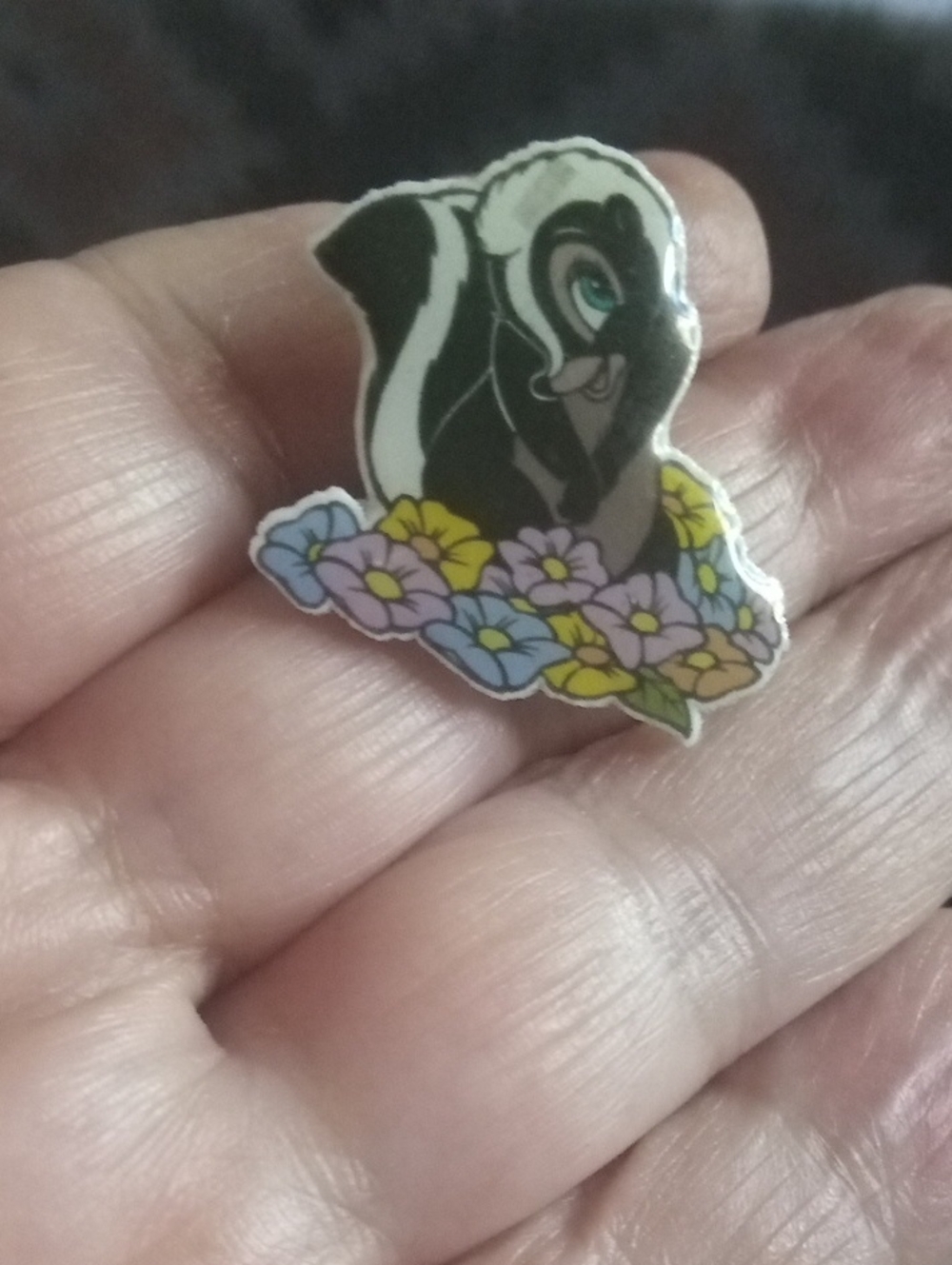 🦨 Black and White Skunk Lapen Pin with Floral Accent